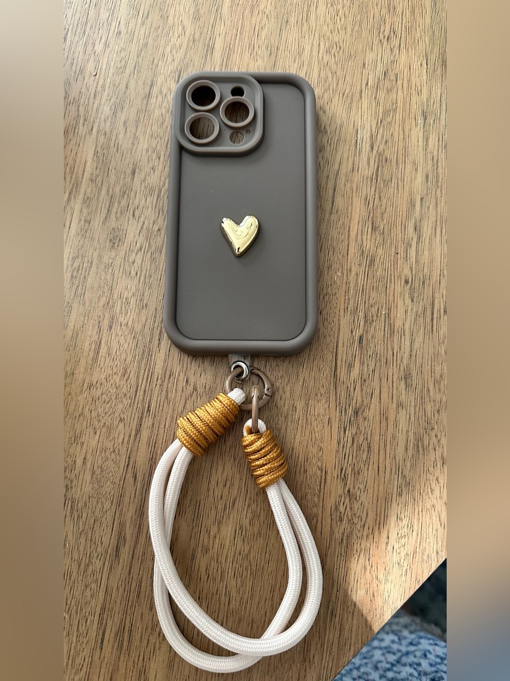 Brown Phone Case with Gold Heart Accent and creme/Gold Wrist Strap iPhone 14pro